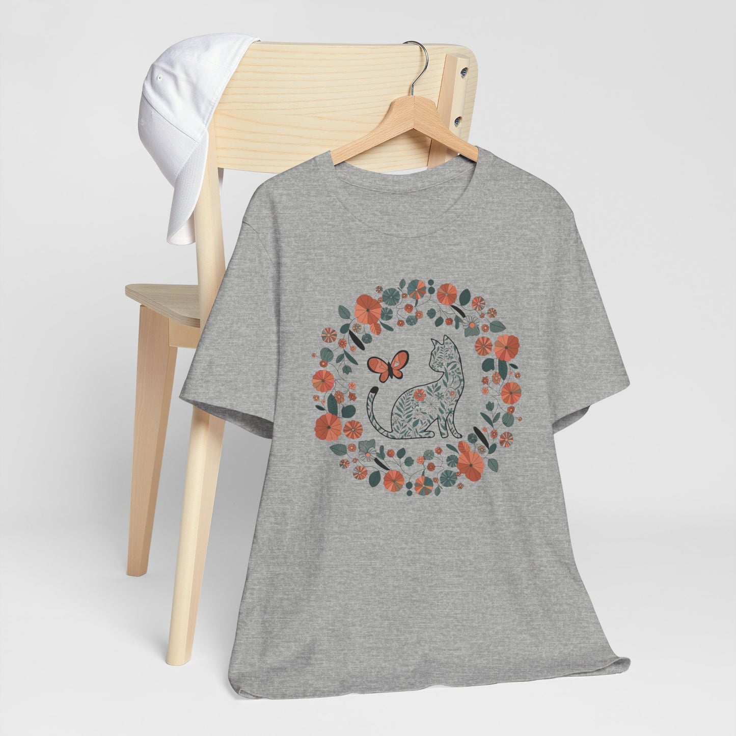 Floral Cat T-shirt with Butterfly This floral cat t-shirt will look great on you for any occassion. Featuring a cat, flowers, and a butterfly, this shirt is sure to catch everyone's eye. The beautiful design will have people asking, "where did you get tha