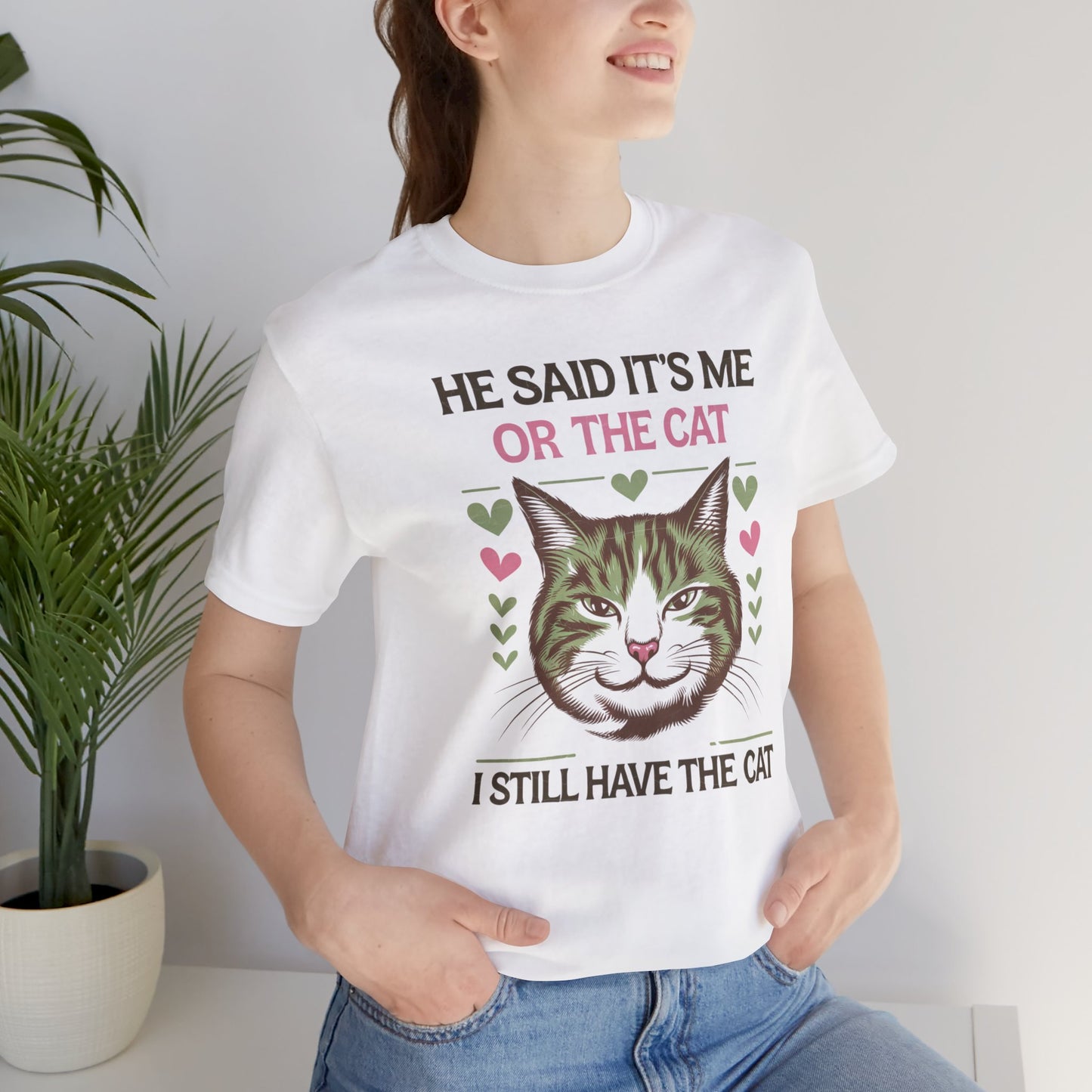 Me or the Cat Valentine's Tee A humorous T-shirt design that expresses the love and preference for cats in a playful way. The tee provides a casual and comfortable vibe, perfect for cat lovers of all ages to wear in everyday situations. Ideal for cat owne