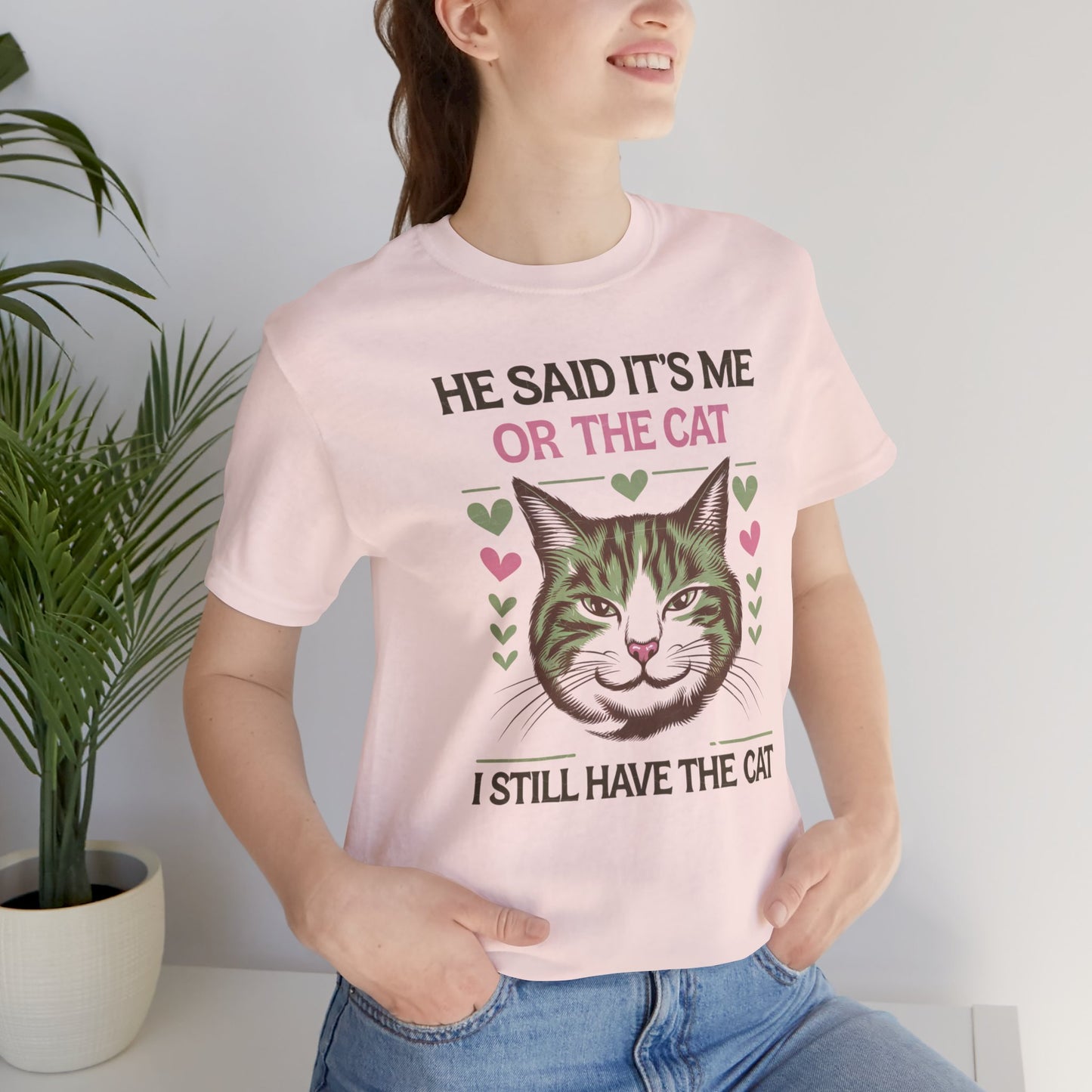 Me or the Cat Valentine's Tee A humorous T-shirt design that expresses the love and preference for cats in a playful way. The tee provides a casual and comfortable vibe, perfect for cat lovers of all ages to wear in everyday situations. Ideal for cat owne