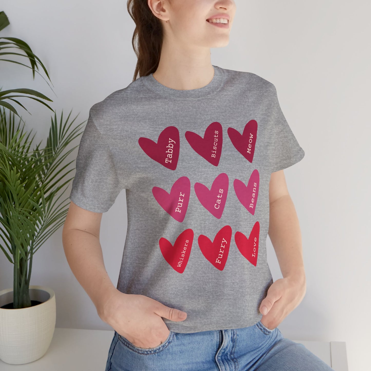 Cat Hearts Valentine’s Day Tshirt This T-Shirt features a cute design of Valentine's Day hearts with various cat types, giving off a playful and festive vibe. It is perfect for cat lovers celebrating Valentine's Day or looking to add a fun touch to their
