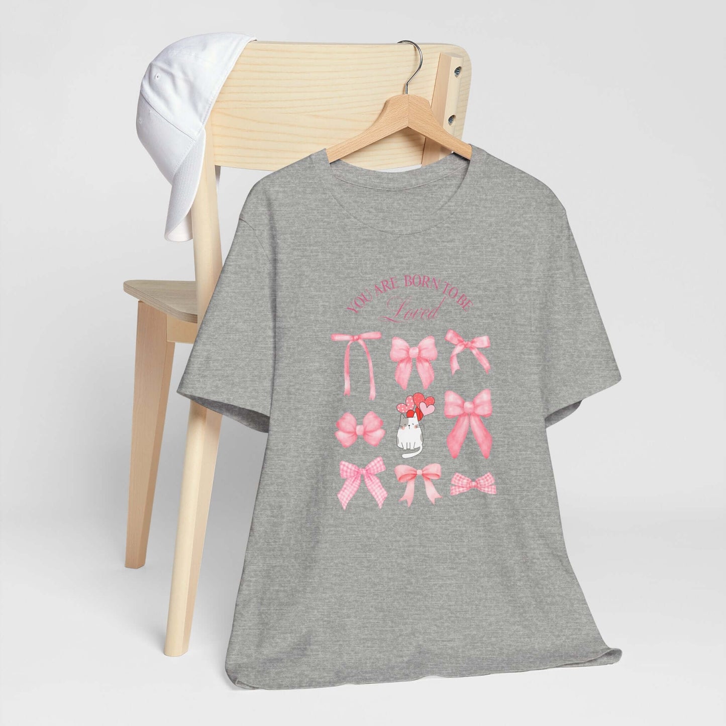 You Are Born To Be Loved Coquette Cat Tee This coquette cat valentines tee radiates a cute and playful vibe, perfect for those who are born to be loved. Product features- Unisex jersey short sleeve tee- Made with 100% lightweight cotton for breathability