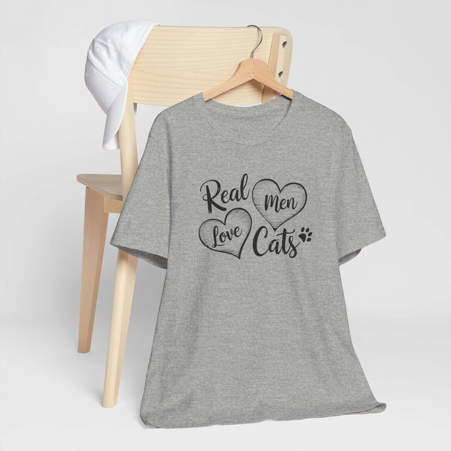 Real Men Love Cats Valentine's Day Tee A fun and playful T-Shirt design that showcases the love for cats. Real Men Love Cats makes a bold statement and comes in a nice comfy tee! Product features- Unisex jersey short sleeve tee- Made with 100% lightweight