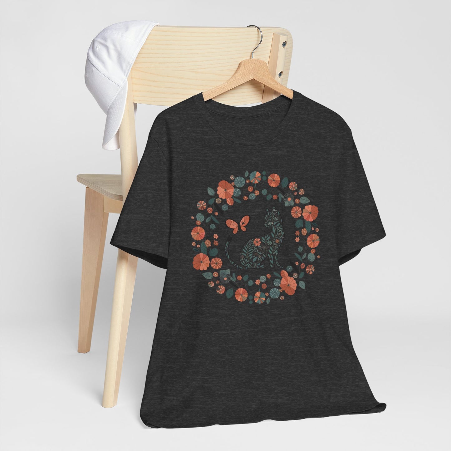 Floral Cat T-shirt with Butterfly This floral cat t-shirt will look great on you for any occassion. Featuring a cat, flowers, and a butterfly, this shirt is sure to catch everyone's eye. The beautiful design will have people asking, "where did you get tha