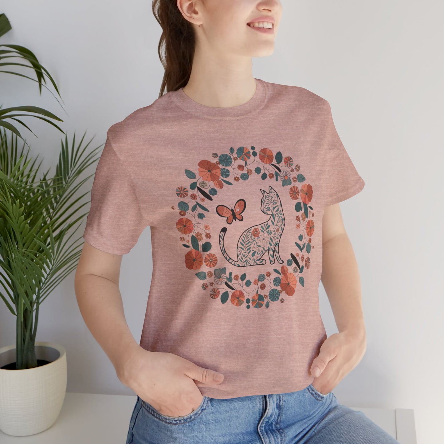 Floral Cat T-shirt with Butterfly This floral cat t-shirt will look great on you for any occassion. Featuring a cat, flowers, and a butterfly, this shirt is sure to catch everyone's eye. The beautiful design will have people asking, "where did you get tha