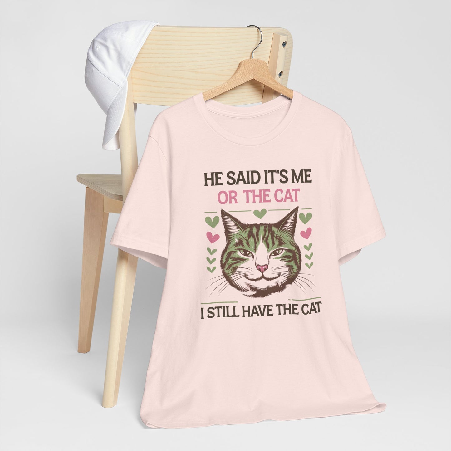 Me or the Cat Valentine's Tee A humorous T-shirt design that expresses the love and preference for cats in a playful way. The tee provides a casual and comfortable vibe, perfect for cat lovers of all ages to wear in everyday situations. Ideal for cat owne