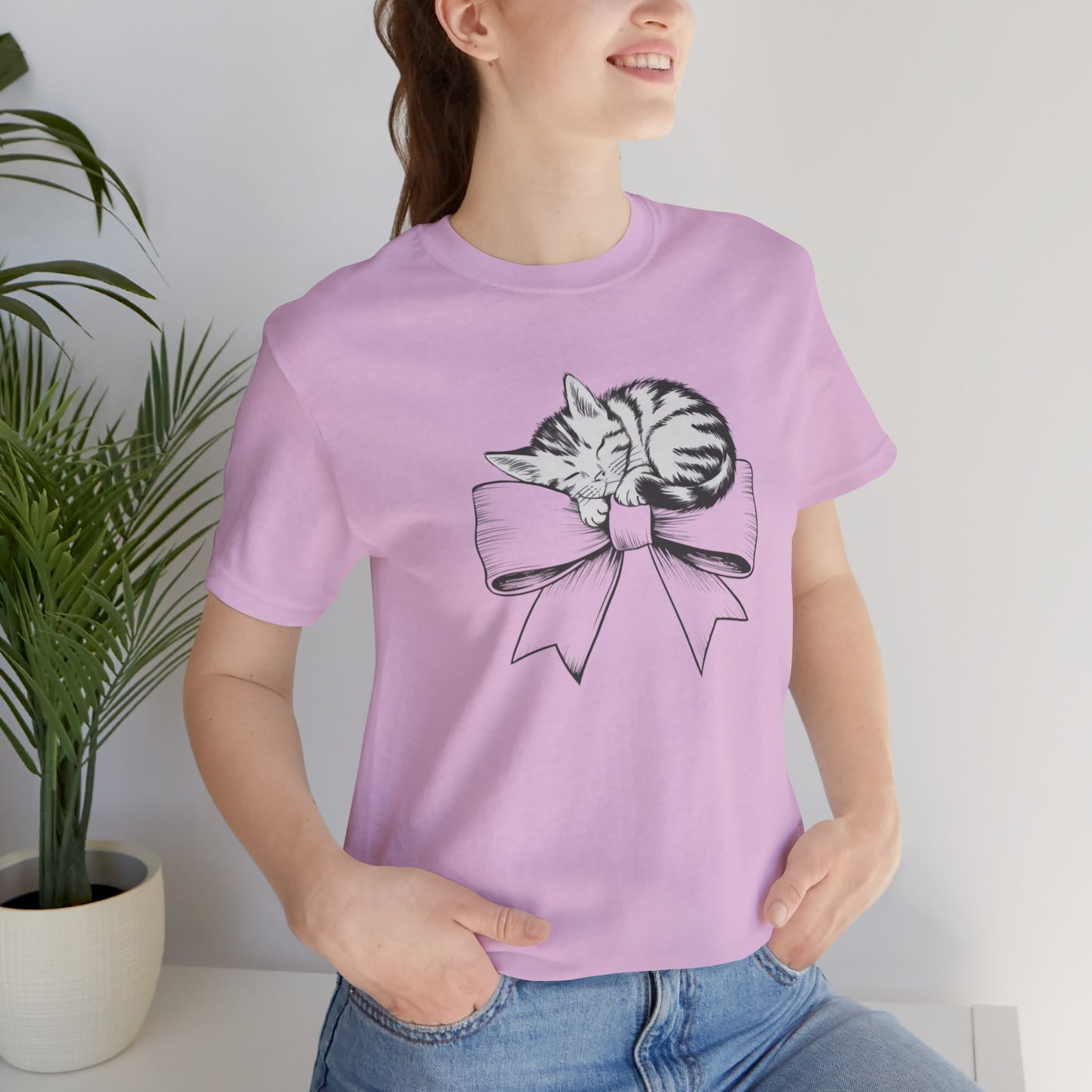 Kitten Bow Valentine's Day Tee This kitten bow Valentines t-shirt exudes a cute and adorable vibe, perfect for celebrating Valentine's Day or showing some love year-round. Product features- Unisex jersey short sleeve tee- Made with 100% lightweight cotton