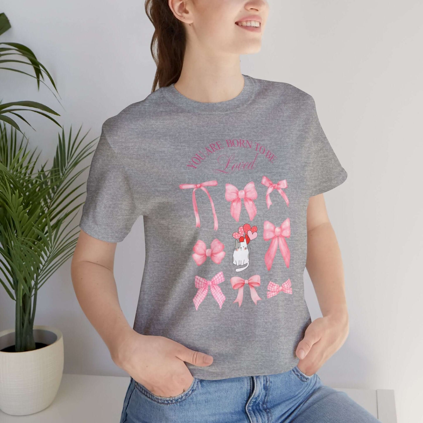 You Are Born To Be Loved Coquette Cat Tee This coquette cat valentines tee radiates a cute and playful vibe, perfect for those who are born to be loved. Product features- Unisex jersey short sleeve tee- Made with 100% lightweight cotton for breathability