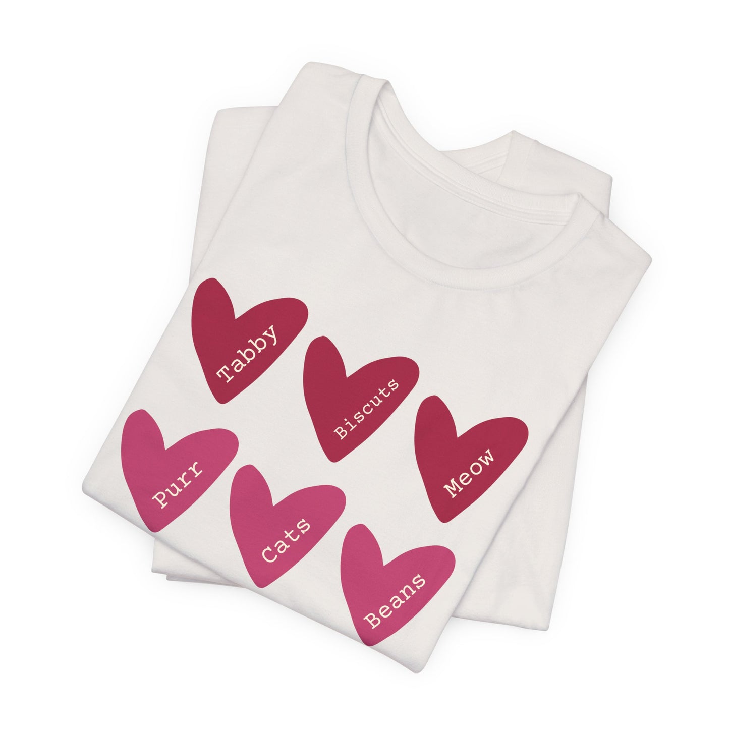 Cat Hearts Valentine’s Day Tshirt This T-Shirt features a cute design of Valentine's Day hearts with various cat types, giving off a playful and festive vibe. It is perfect for cat lovers celebrating Valentine's Day or looking to add a fun touch to their