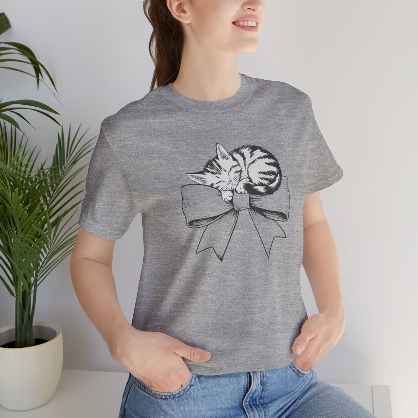 Kitten Bow Valentine's Day Tee This kitten bow Valentines t-shirt exudes a cute and adorable vibe, perfect for celebrating Valentine's Day or showing some love year-round. Product features- Unisex jersey short sleeve tee- Made with 100% lightweight cotton