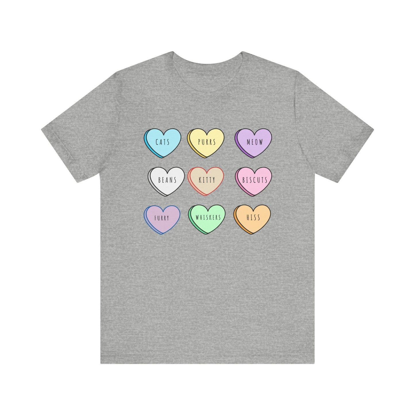 Tshirt featuring candy Hearts with words inside including cats, meow, kitty, purrs, whiskers, beans, furry. The words and candy hearts all describe different cat attributes.