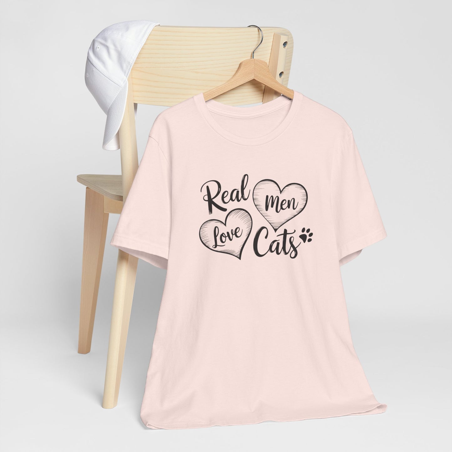 Real Men Love Cats Valentine's Day Tee A fun and playful T-Shirt design that showcases the love for cats. Real Men Love Cats makes a bold statement and comes in a nice comfy tee! Product features- Unisex jersey short sleeve tee- Made with 100% lightweight