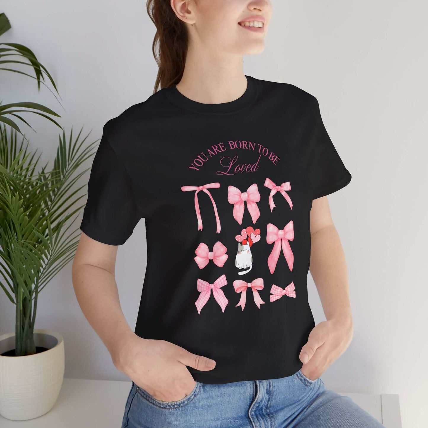 You Are Born To Be Loved Coquette Cat Tee This coquette cat valentines tee radiates a cute and playful vibe, perfect for those who are born to be loved. Product features- Unisex jersey short sleeve tee- Made with 100% lightweight cotton for breathability