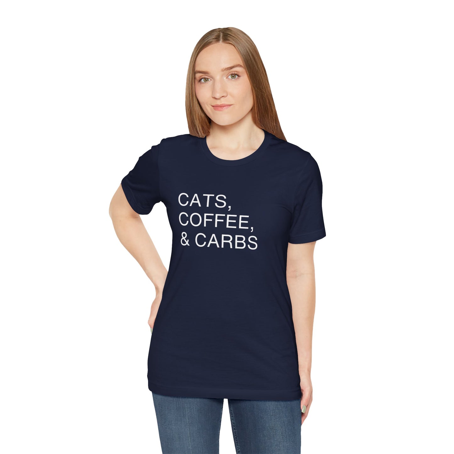 Cats, Coffee, and Carbs, Minimalist Tee This tee is a must-have for any proud cat parent who can't get enough of their furry friends, their daily coffee fix, and their favorite comfort foods. Wear it as a badge of honor and connect with fellow cat lovers