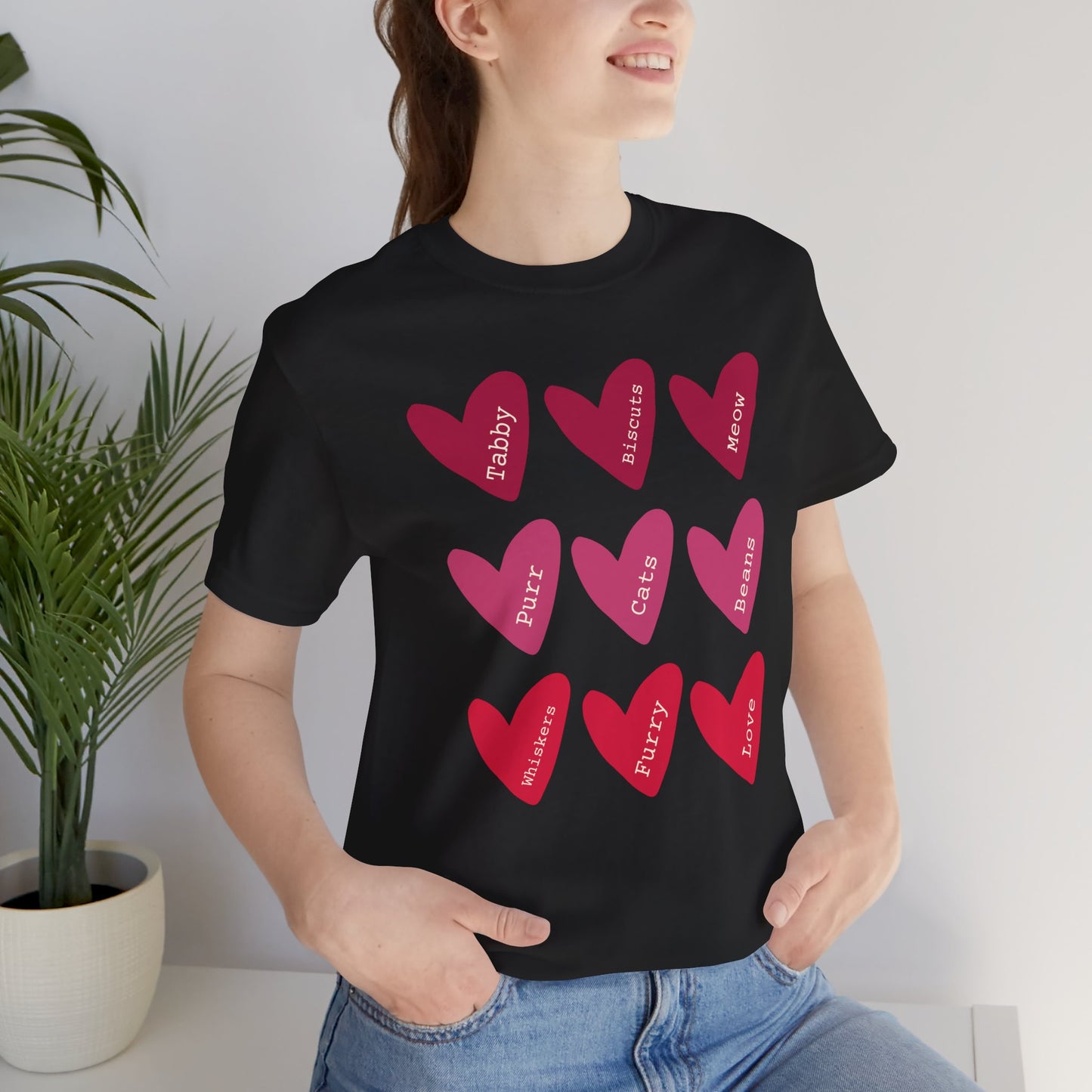 Cat Hearts Valentine’s Day Tshirt This T-Shirt features a cute design of Valentine's Day hearts with various cat types, giving off a playful and festive vibe. It is perfect for cat lovers celebrating Valentine's Day or looking to add a fun touch to their