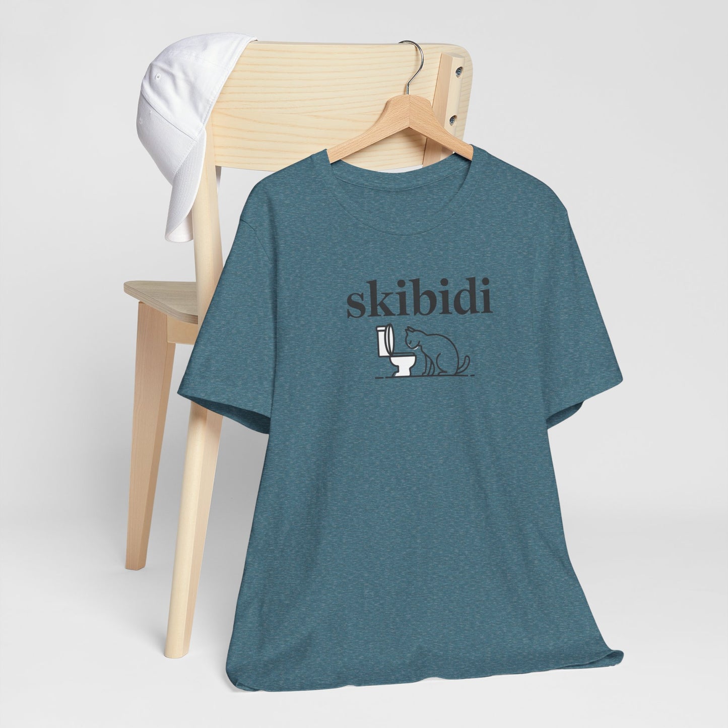 Funny Skibidi Toilet Cat Shirt Turn heads and spark laughter with our hilarious "Skibidi" T-shirt! Featuring a mischievous cat inspecting a toilet, this design is the perfect blend of quirky cat humor and minimalist style. Whether you're a cat lover, meme
