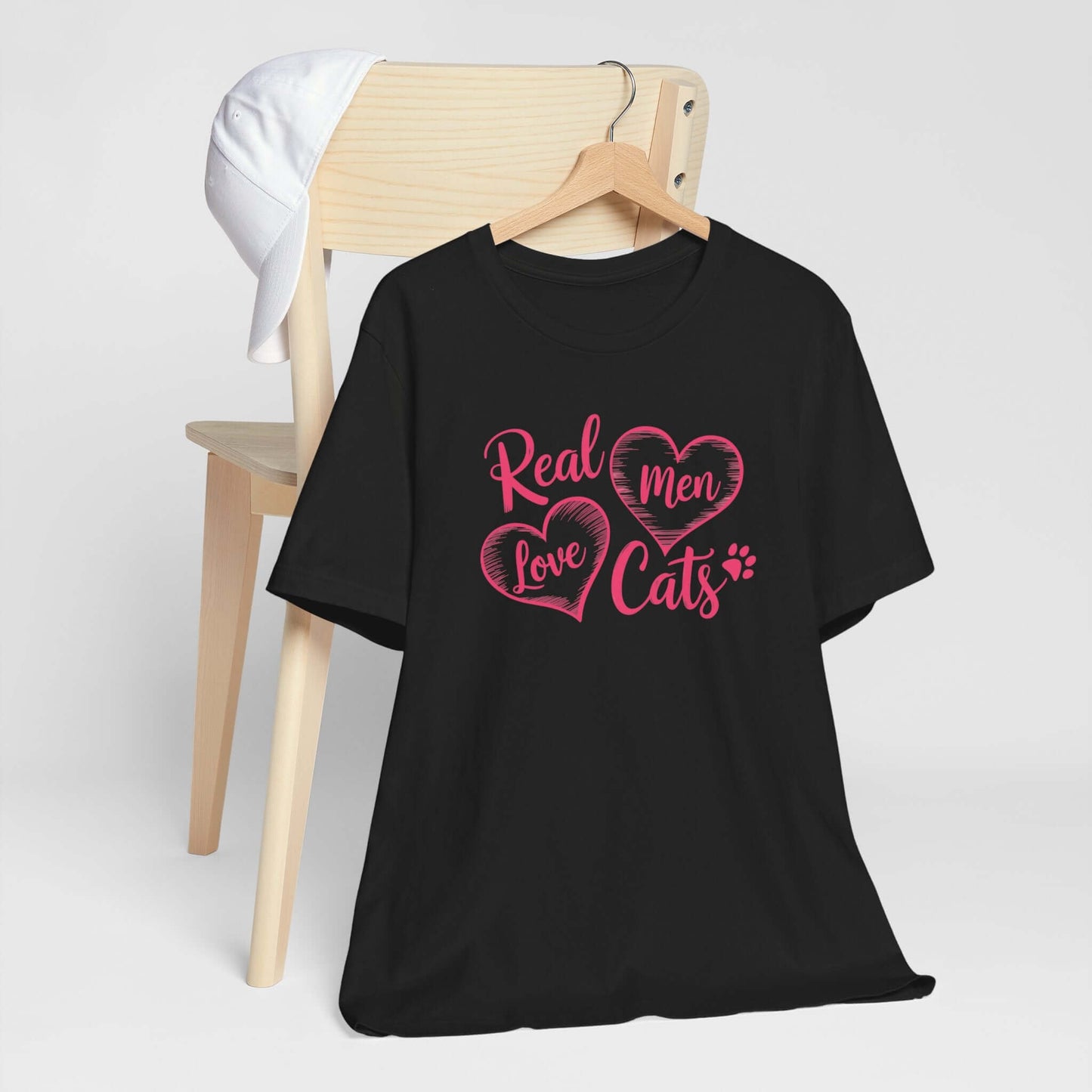 Real Men Love Cats Valentine's Day Tee A fun and playful T-Shirt design that showcases the love for cats. Real Men Love Cats makes a bold statement and comes in a nice comfy tee! Product features- Unisex jersey short sleeve tee- Made with 100% lightweight