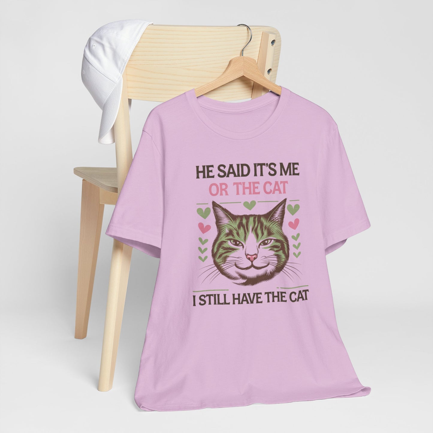 Me or the Cat Valentine's Tee A humorous T-shirt design that expresses the love and preference for cats in a playful way. The tee provides a casual and comfortable vibe, perfect for cat lovers of all ages to wear in everyday situations. Ideal for cat owne