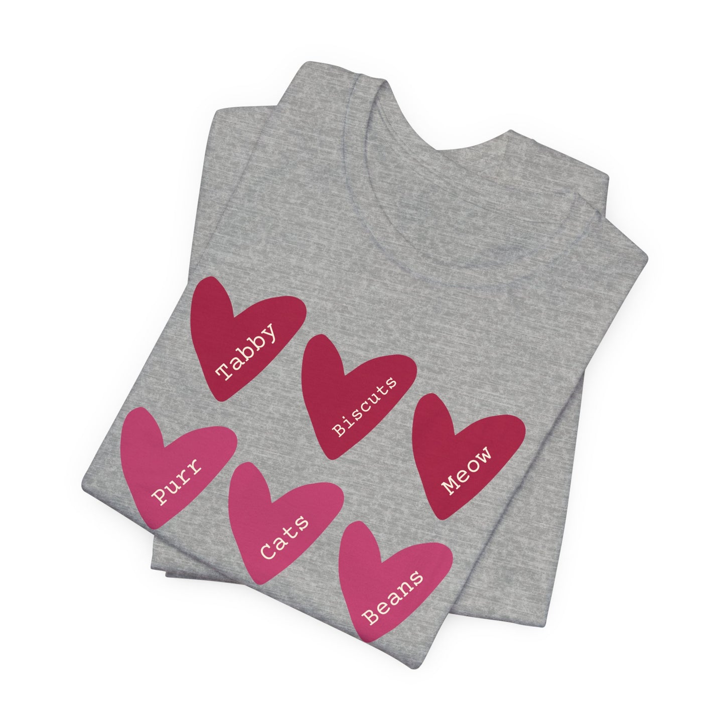 Cat Hearts Valentine’s Day Tshirt This T-Shirt features a cute design of Valentine's Day hearts with various cat types, giving off a playful and festive vibe. It is perfect for cat lovers celebrating Valentine's Day or looking to add a fun touch to their
