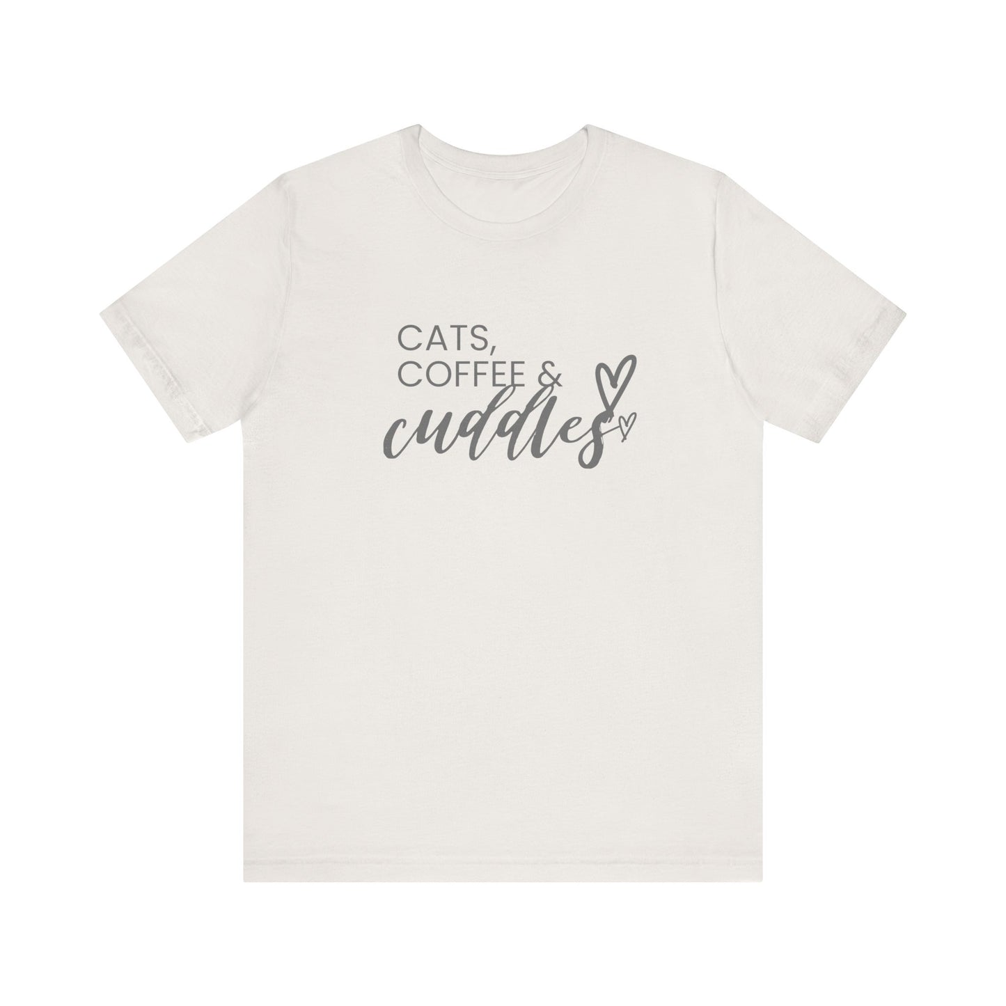 Cats, Coffee, Cuddles Tee Embrace the blissful trifecta of cats, coffee, and cuddles with this delightfully cozy tee. Whether you're curled up on the couch or out and about, this tee lets the world know your priorities - and they're purrfect. Product feat