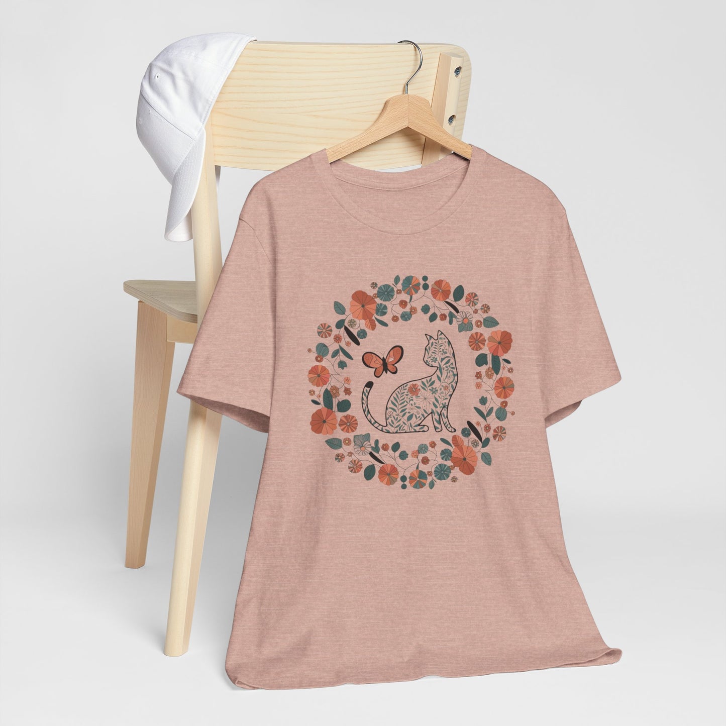 Floral Cat T-shirt with Butterfly This floral cat t-shirt will look great on you for any occassion. Featuring a cat, flowers, and a butterfly, this shirt is sure to catch everyone's eye. The beautiful design will have people asking, "where did you get tha