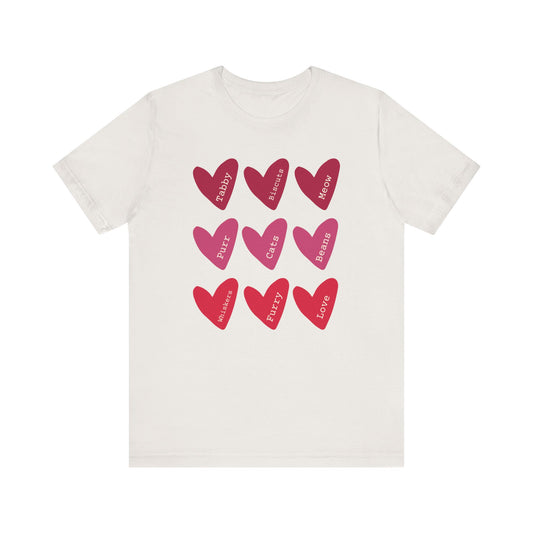Cat Hearts Valentine’s Day Tshirt This T-Shirt features a cute design of Valentine's Day hearts with various cat types, giving off a playful and festive vibe. It is perfect for cat lovers celebrating Valentine's Day or looking to add a fun touch to their