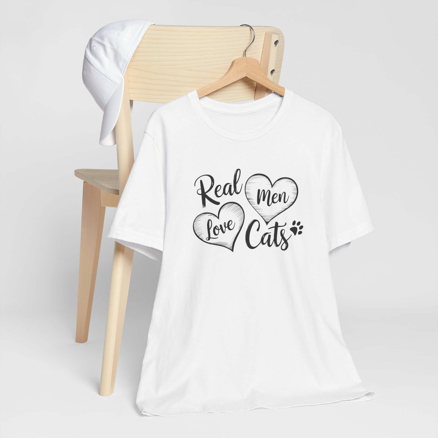 Real Men Love Cats Valentine's Day Tee A fun and playful T-Shirt design that showcases the love for cats. Real Men Love Cats makes a bold statement and comes in a nice comfy tee! Product features- Unisex jersey short sleeve tee- Made with 100% lightweight