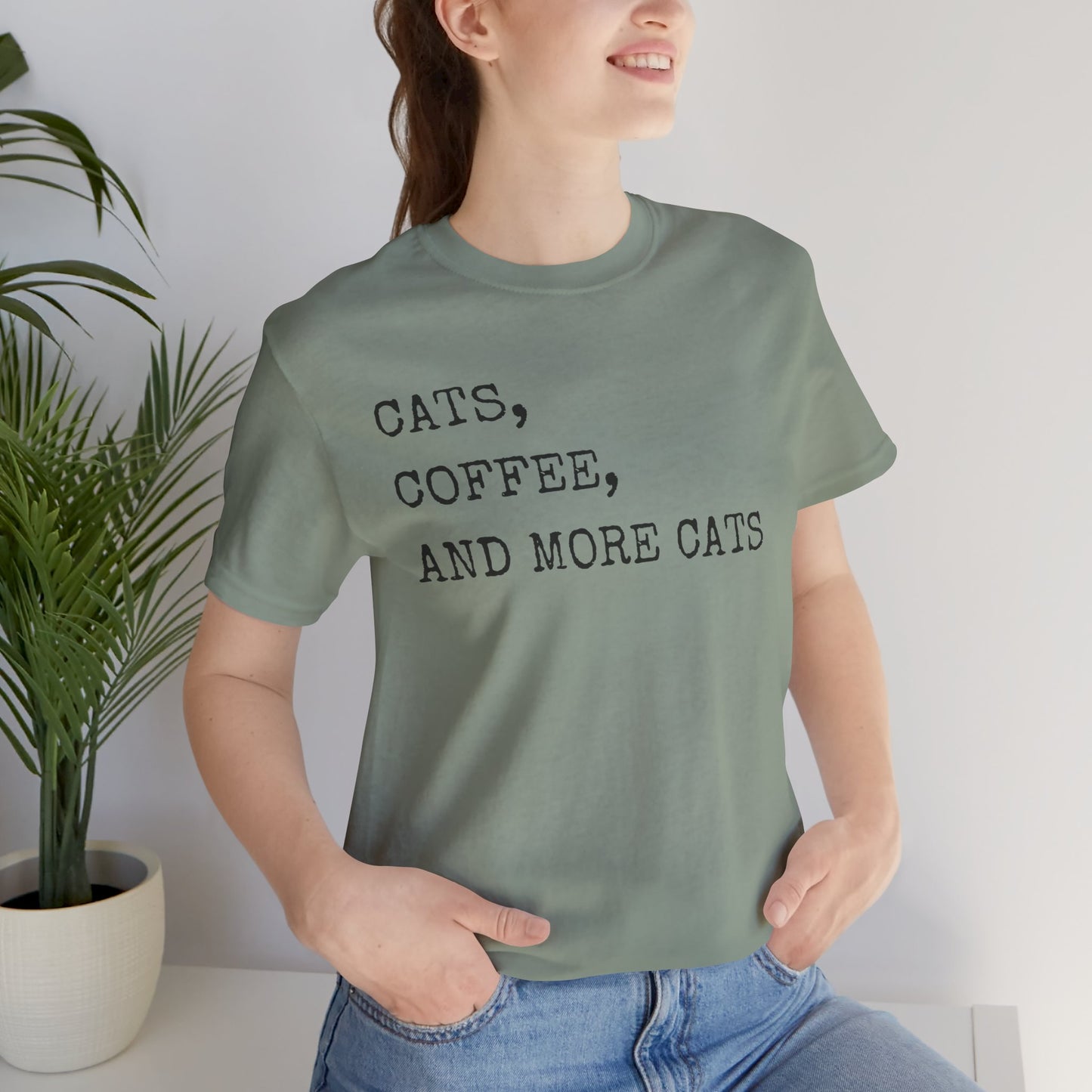 Cats, Coffee, and More Cats Tee If you're the type who can't start the day without a strong cup of coffee and a furry friend by your side, this tee is an absolute must-have. Whether you're a proud cat parent, a casual kitty admirer, or someone who simply