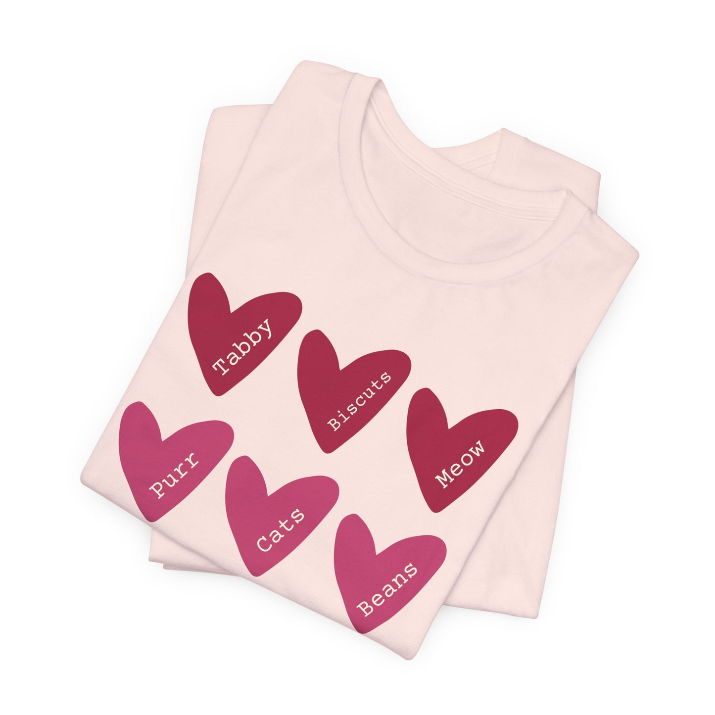 Cat Hearts Valentine’s Day Tshirt This T-Shirt features a cute design of Valentine's Day hearts with various cat types, giving off a playful and festive vibe. It is perfect for cat lovers celebrating Valentine's Day or looking to add a fun touch to their