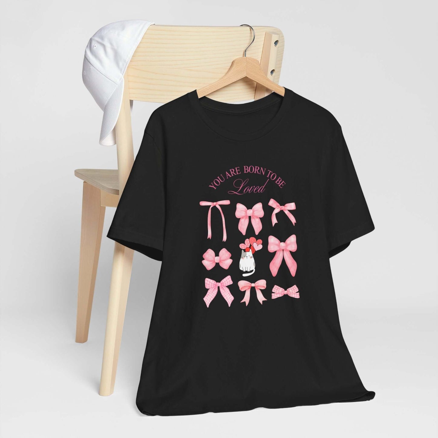 You Are Born To Be Loved Coquette Cat Tee This coquette cat valentines tee radiates a cute and playful vibe, perfect for those who are born to be loved. Product features- Unisex jersey short sleeve tee- Made with 100% lightweight cotton for breathability
