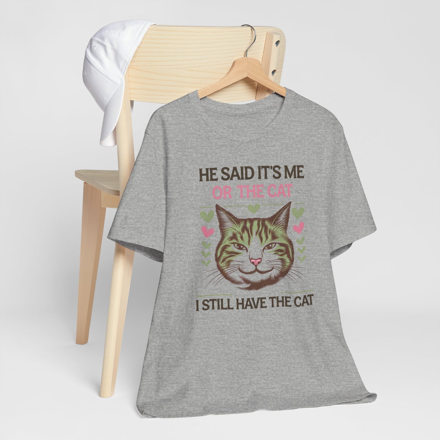 Me or the Cat Valentine's Tee A humorous T-shirt design that expresses the love and preference for cats in a playful way. The tee provides a casual and comfortable vibe, perfect for cat lovers of all ages to wear in everyday situations. Ideal for cat owne
