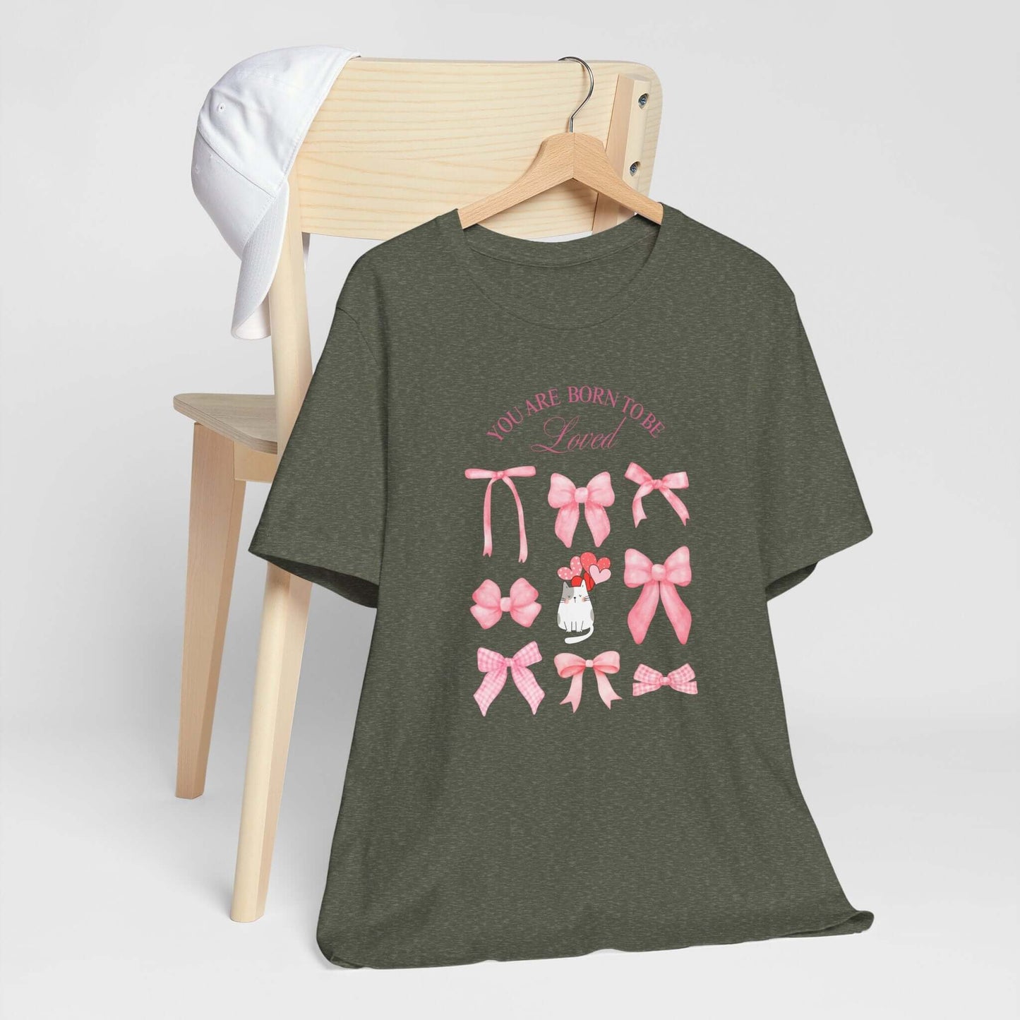 You Are Born To Be Loved Coquette Cat Tee This coquette cat valentines tee radiates a cute and playful vibe, perfect for those who are born to be loved. Product features- Unisex jersey short sleeve tee- Made with 100% lightweight cotton for breathability