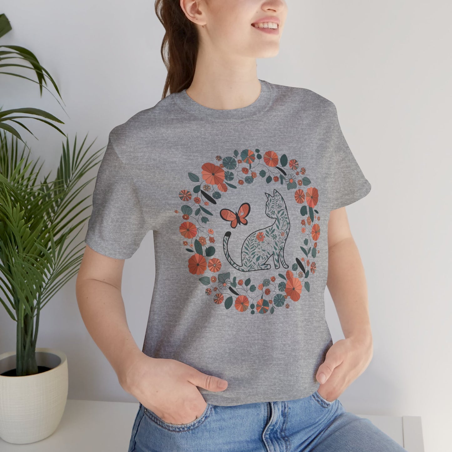 Floral Cat T-shirt with Butterfly This floral cat t-shirt will look great on you for any occassion. Featuring a cat, flowers, and a butterfly, this shirt is sure to catch everyone's eye. The beautiful design will have people asking, "where did you get tha