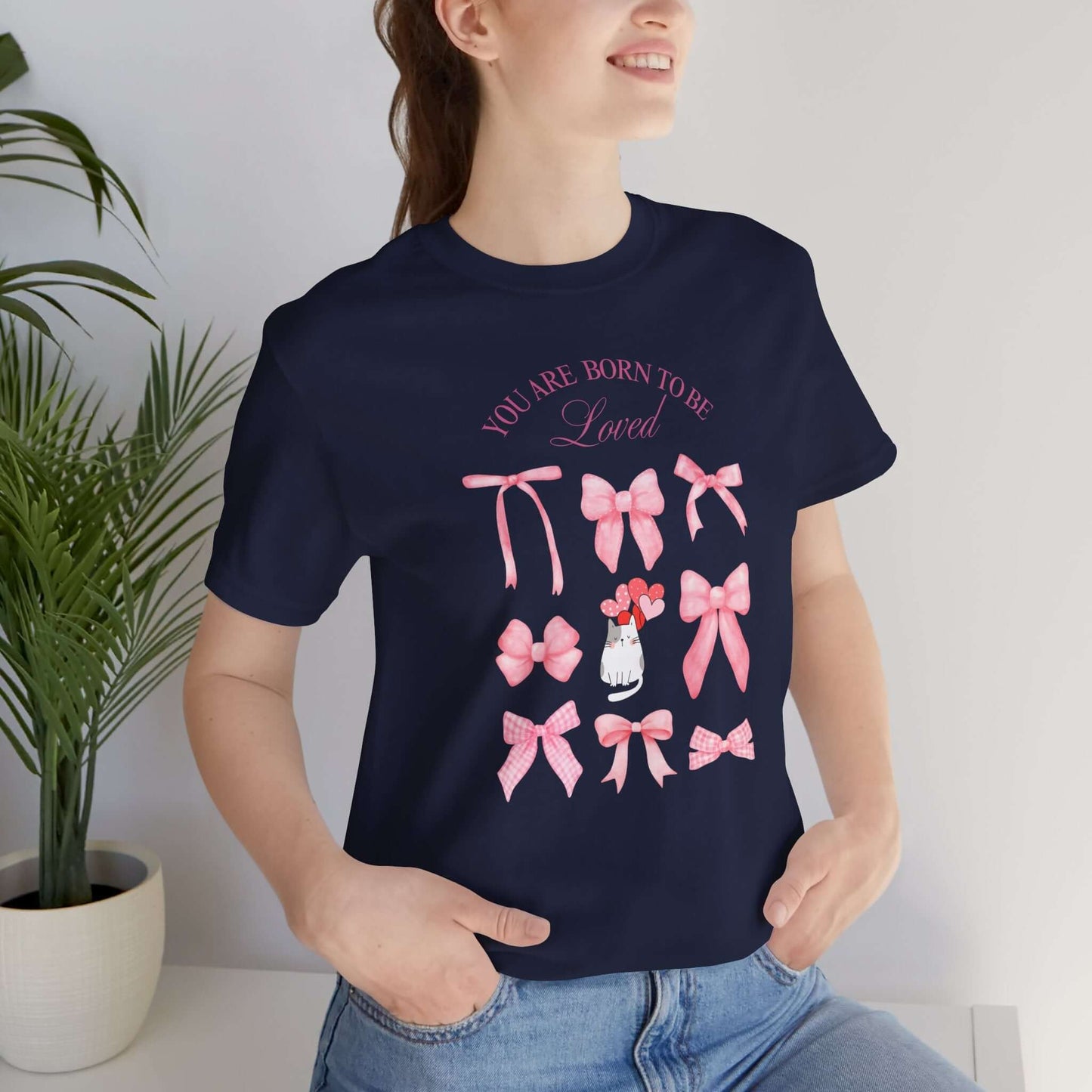 You Are Born To Be Loved Coquette Cat Tee This coquette cat valentines tee radiates a cute and playful vibe, perfect for those who are born to be loved. Product features- Unisex jersey short sleeve tee- Made with 100% lightweight cotton for breathability