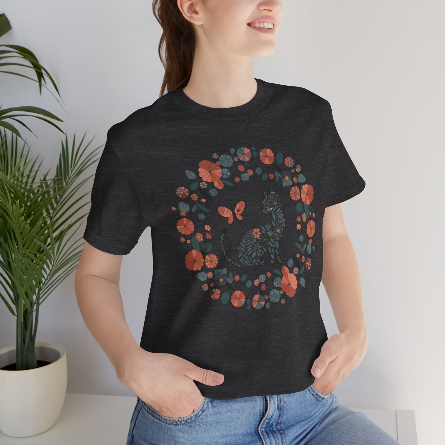 Floral Cat T-shirt with Butterfly This floral cat t-shirt will look great on you for any occassion. Featuring a cat, flowers, and a butterfly, this shirt is sure to catch everyone's eye. The beautiful design will have people asking, "where did you get tha