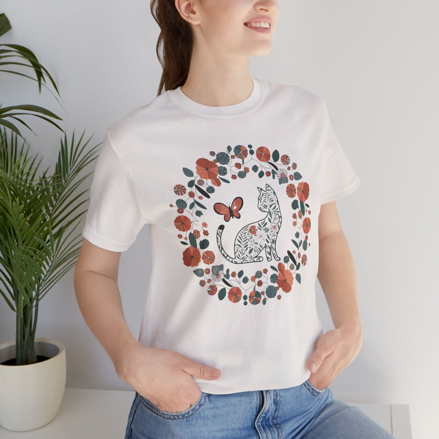 Floral Cat T-shirt with Butterfly This floral cat t-shirt will look great on you for any occassion. Featuring a cat, flowers, and a butterfly, this shirt is sure to catch everyone's eye. The beautiful design will have people asking, "where did you get tha