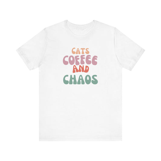 Cats and Coffee and Chaos Tee This shirt celebrates the joyful chaos that comes with loving cats and coffee. Whether you're sipping your morning brew or cuddling your kitty, this shirt lets the world know your passions. Wear it with pride and let the comp