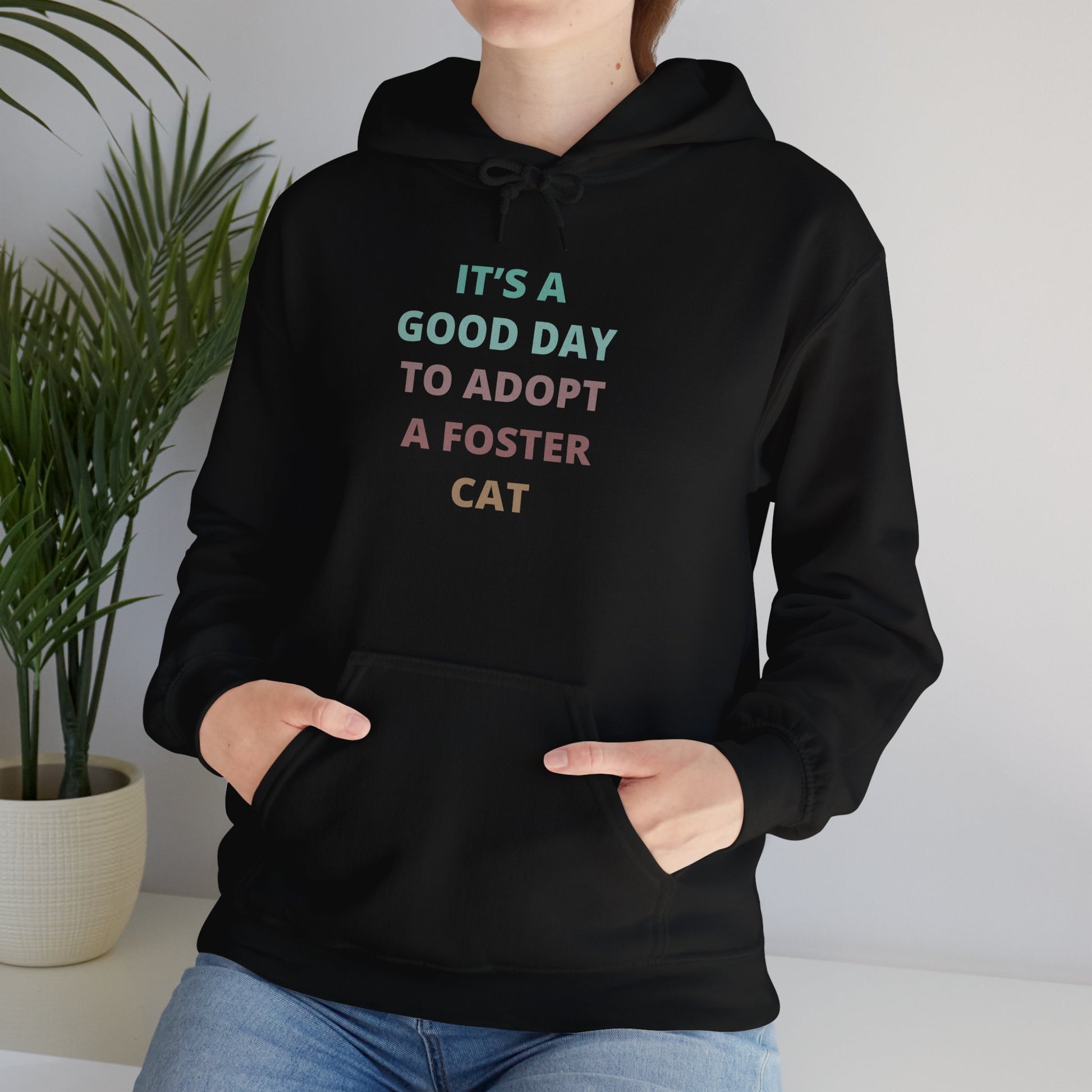 Hoodie with the multi colored text It's a good day to adopt a foster cat