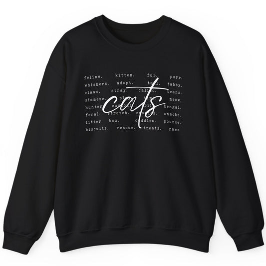 sweatshirt with a centered cursive text of"cats". In the backround are smaller words describing cats