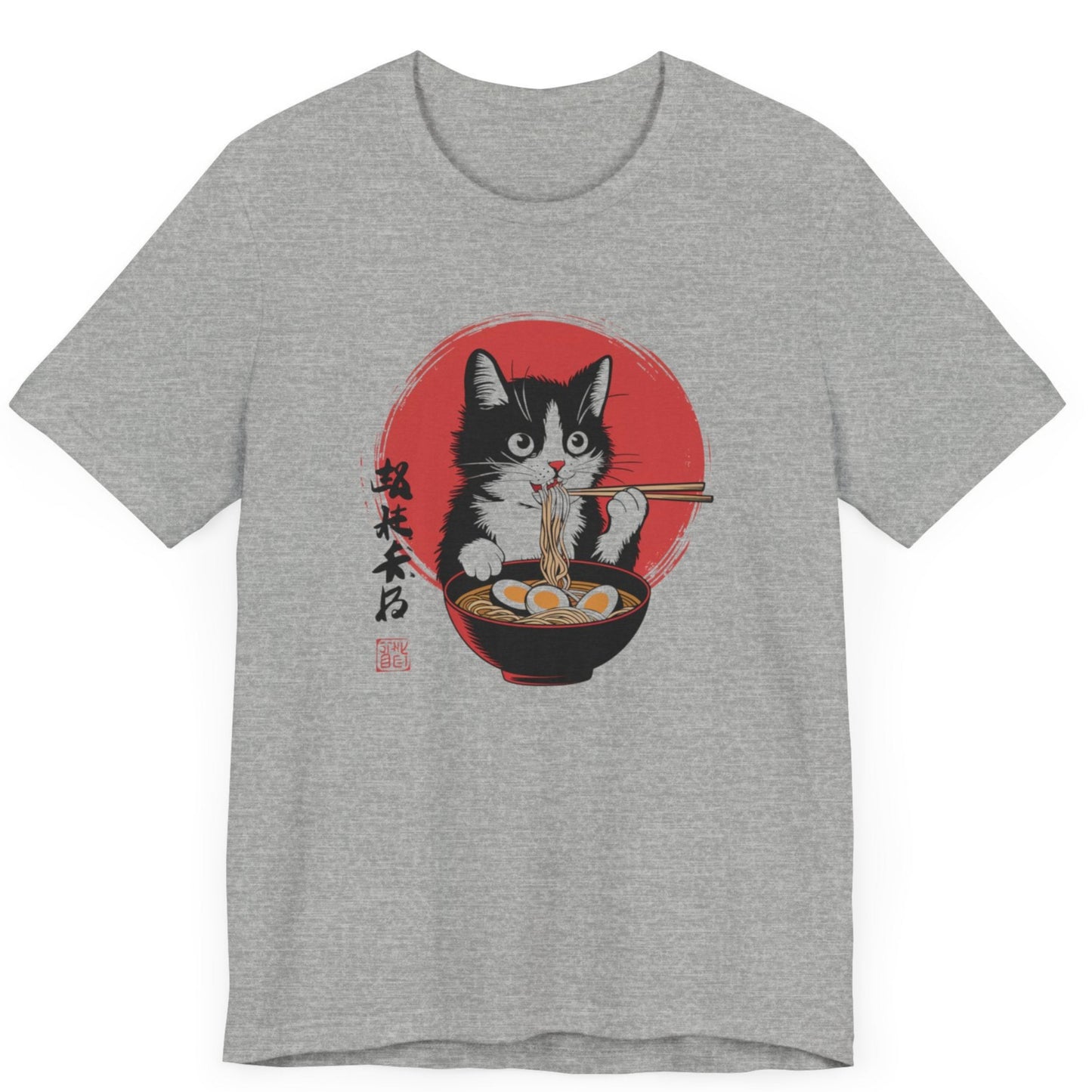 A tshirt featuring a cat enjoying ramen noodles. The cat is eating the ramen noodles with chopsticks. The shirt also features japanese symbols